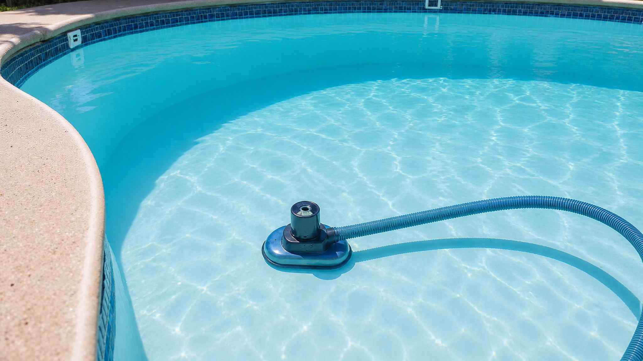vacuuming an above ground pool